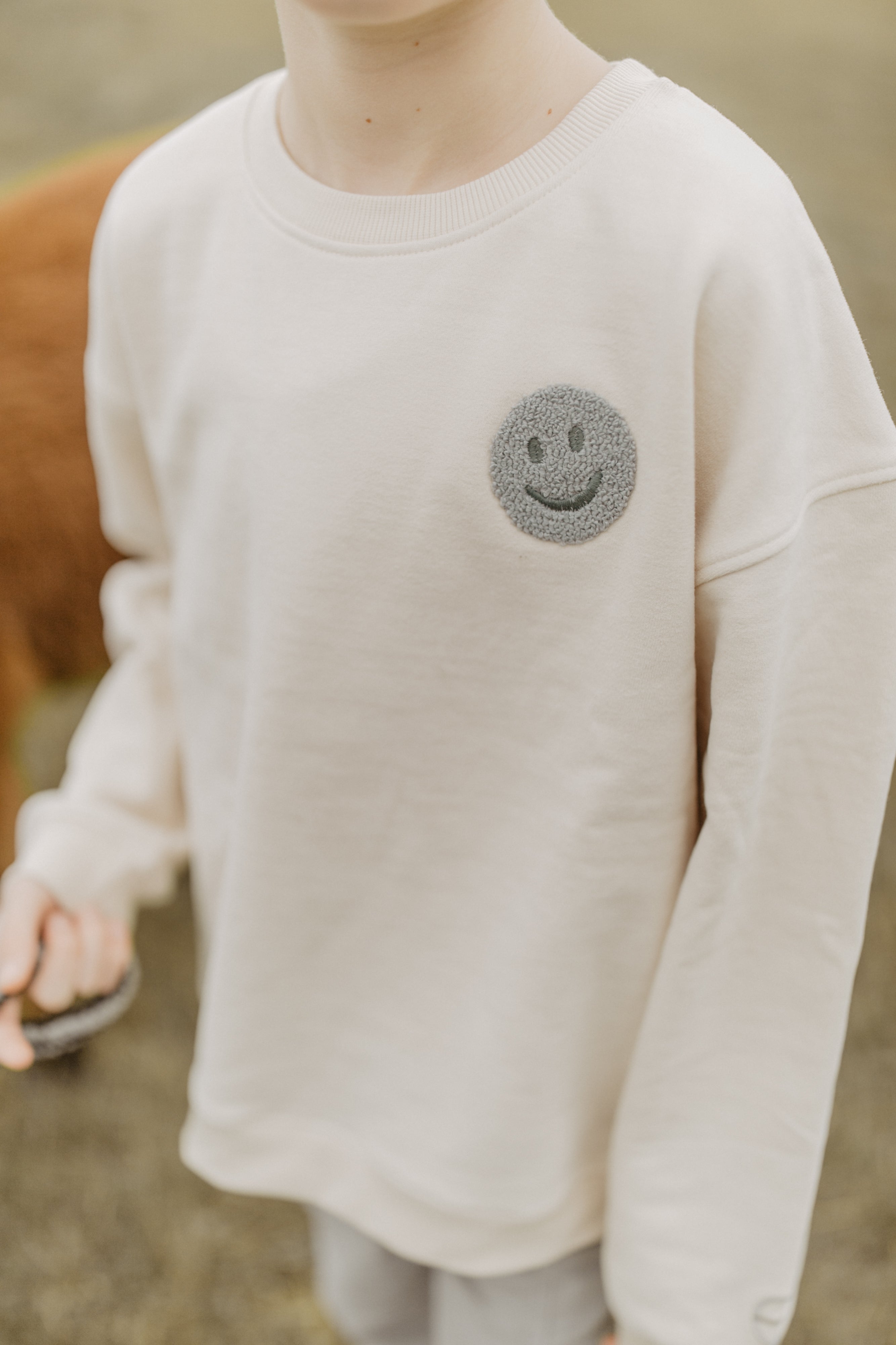 Unisex Oversized Sweatshirt 'peace begins with a smile'